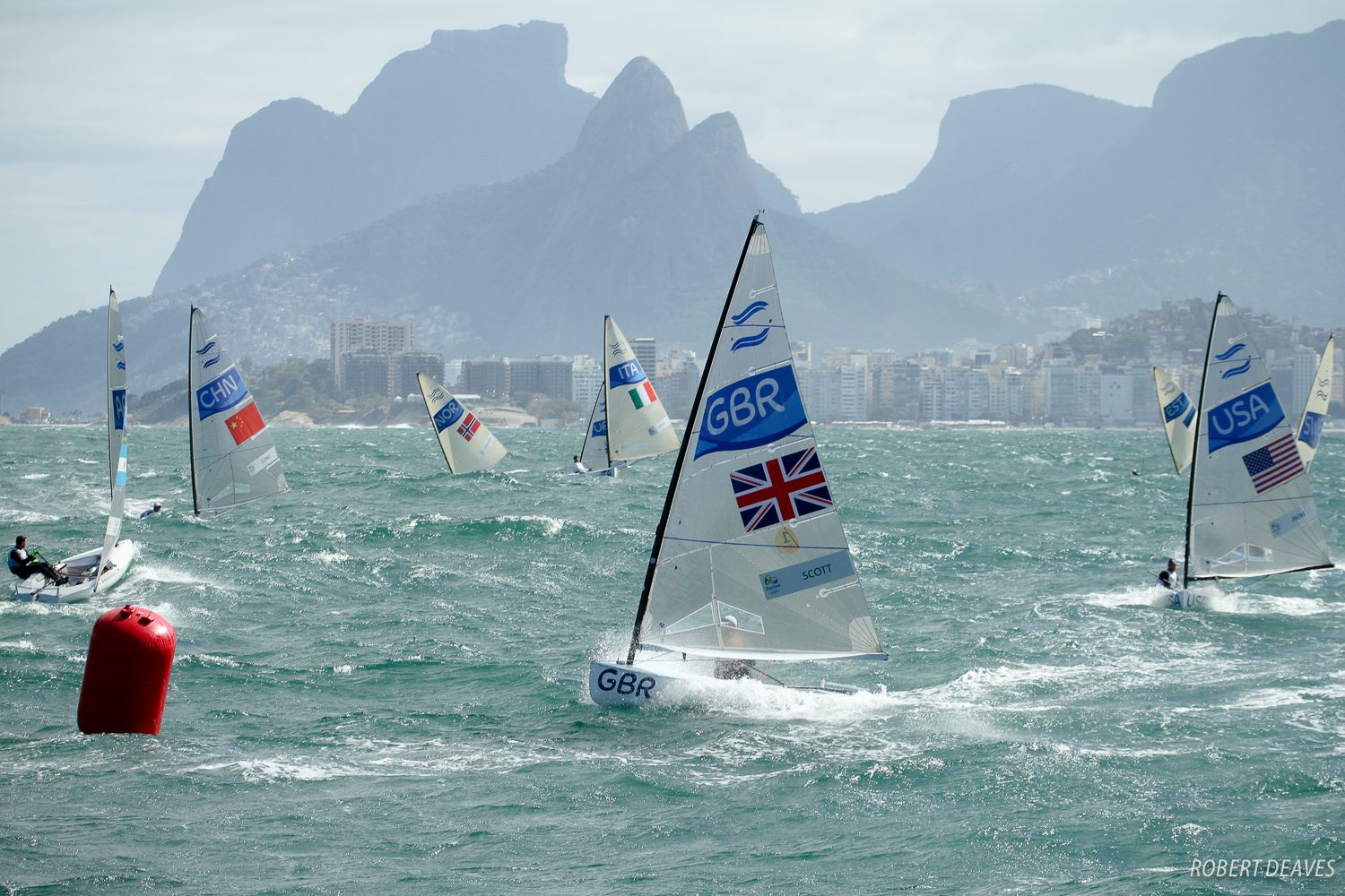 Giles Scott leads windy day 4